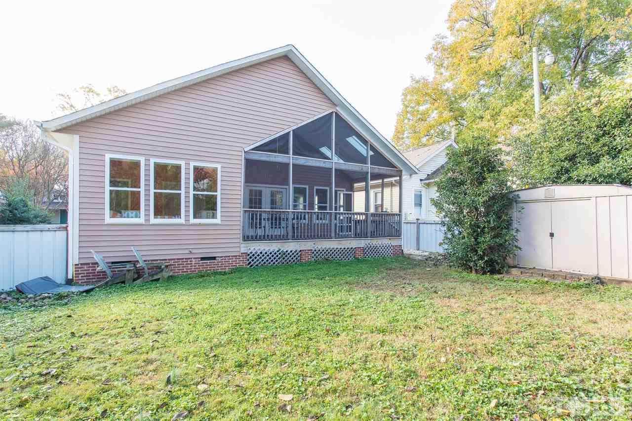 505 Holden Street Raleigh, NC 27604 - Photo 16 of 21 a view of a house with a yard and fence