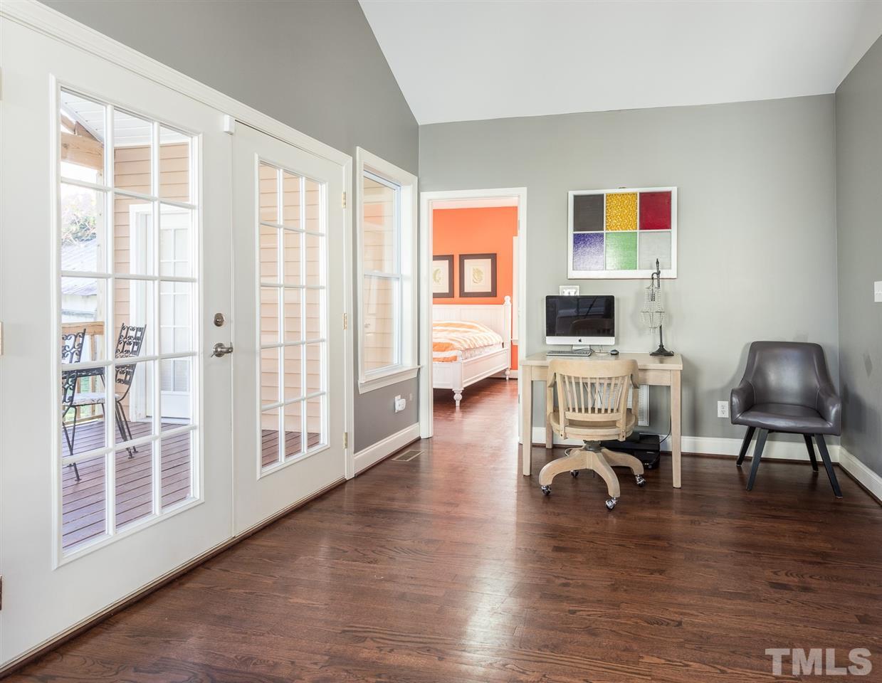 505 Holden Street Raleigh, NC 27604 - Photo 9 of 21 a room with furniture and a wooden floor