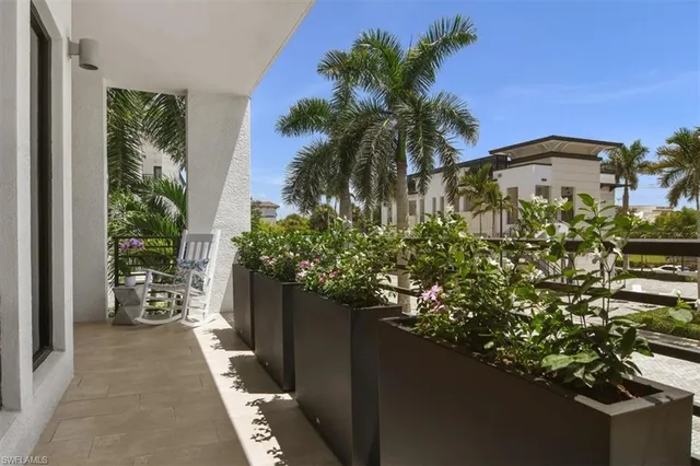 a view of a swimming pool with a lawn chairs