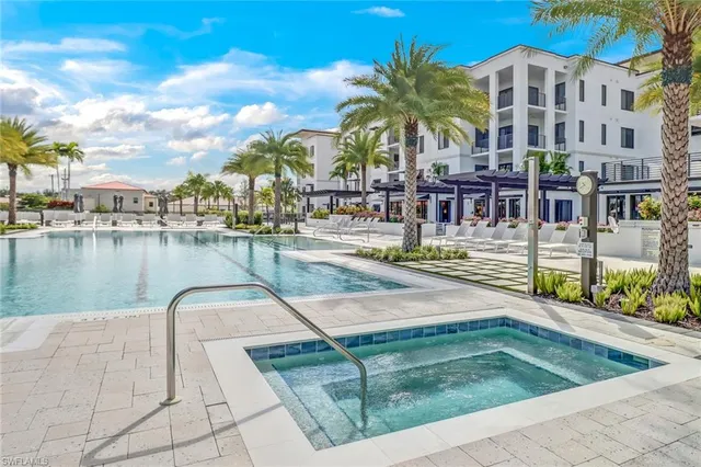a view of a patio with a table and chairs and potted plants
