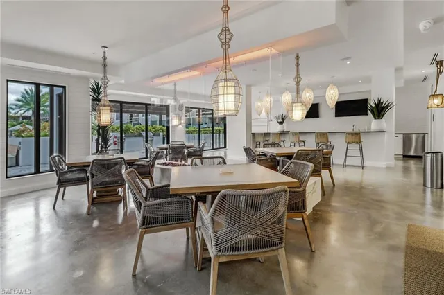 a kitchen with stainless steel appliances granite countertop a sink and a white cabinets