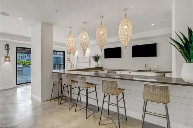 a kitchen with stainless steel appliances white cabinets and a microwave oven