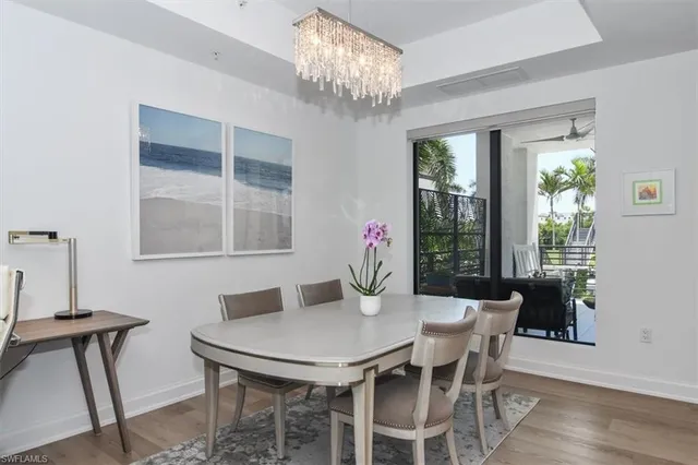 a view of a dining room with furniture and window