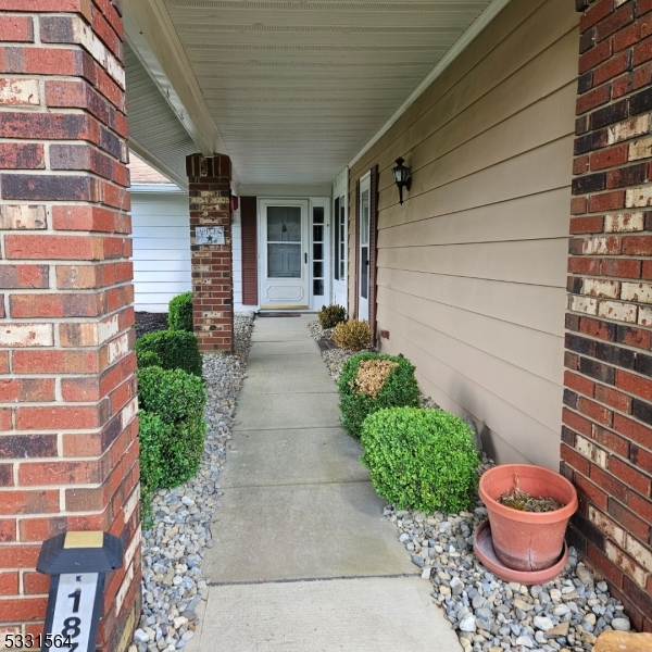 187 Newport Road Monroe Township, NJ 08831 - Photo 5 of 26 a view of a backyard of the house with potted plants