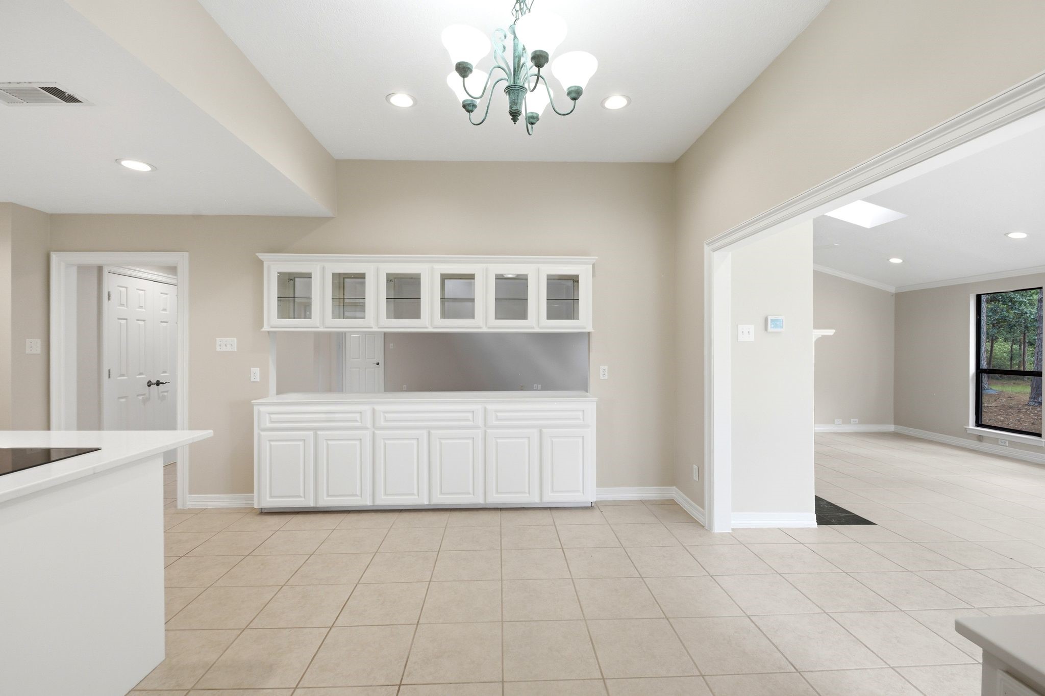 22509 Pebble Beach Way Point Blank, TX 77364 - Photo 13 of 30 Kitchen with built-in hutch, open to the family room