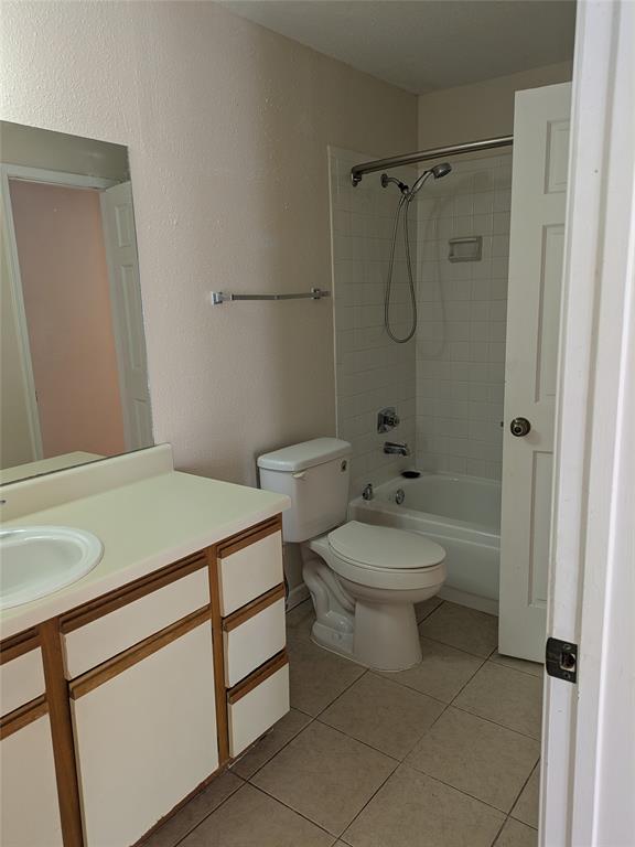 977 Riverside Drive, Unit 226 Coral Springs, FL 33071 - Photo 11 of 13 a bathroom with a toilet a sink and shower