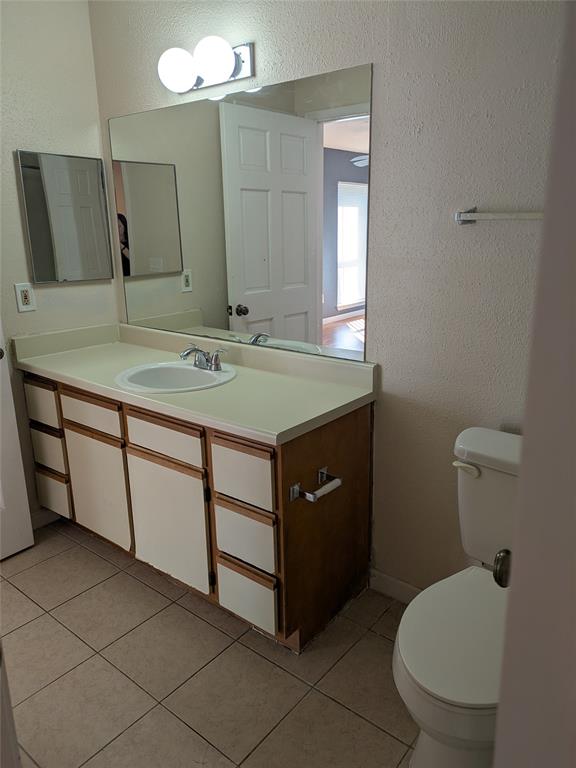 977 Riverside Drive, Unit 226 Coral Springs, FL 33071 - Photo 12 of 13 a bathroom with a sink toilet and mirror