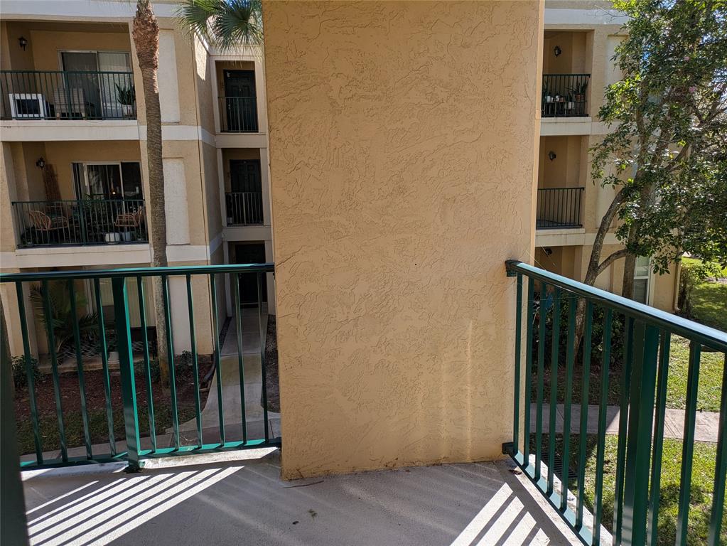 977 Riverside Drive, Unit 226 Coral Springs, FL 33071 - Photo 9 of 13 a view of a house with a balcony