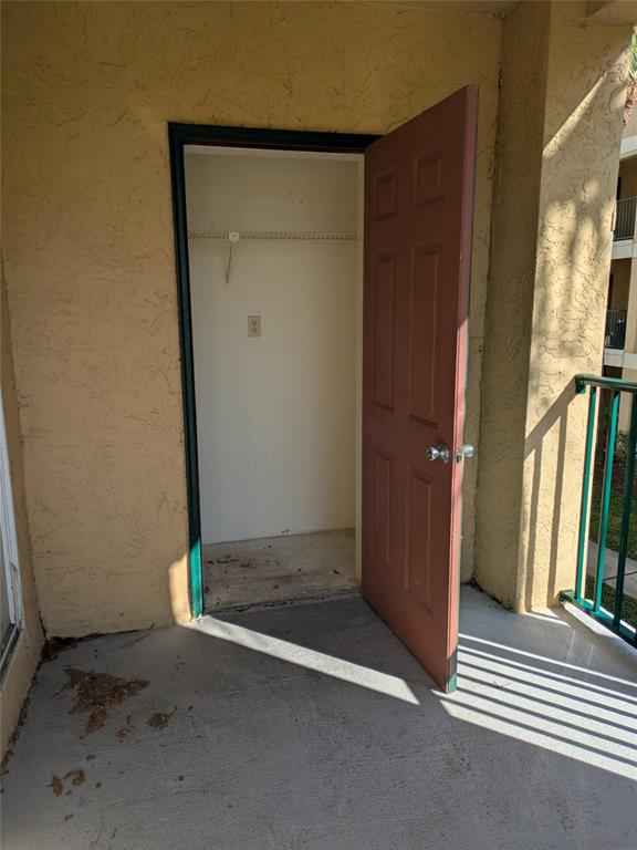 977 Riverside Drive, Unit 226 Coral Springs, FL 33071 - Photo 10 of 13 an empty room with windows