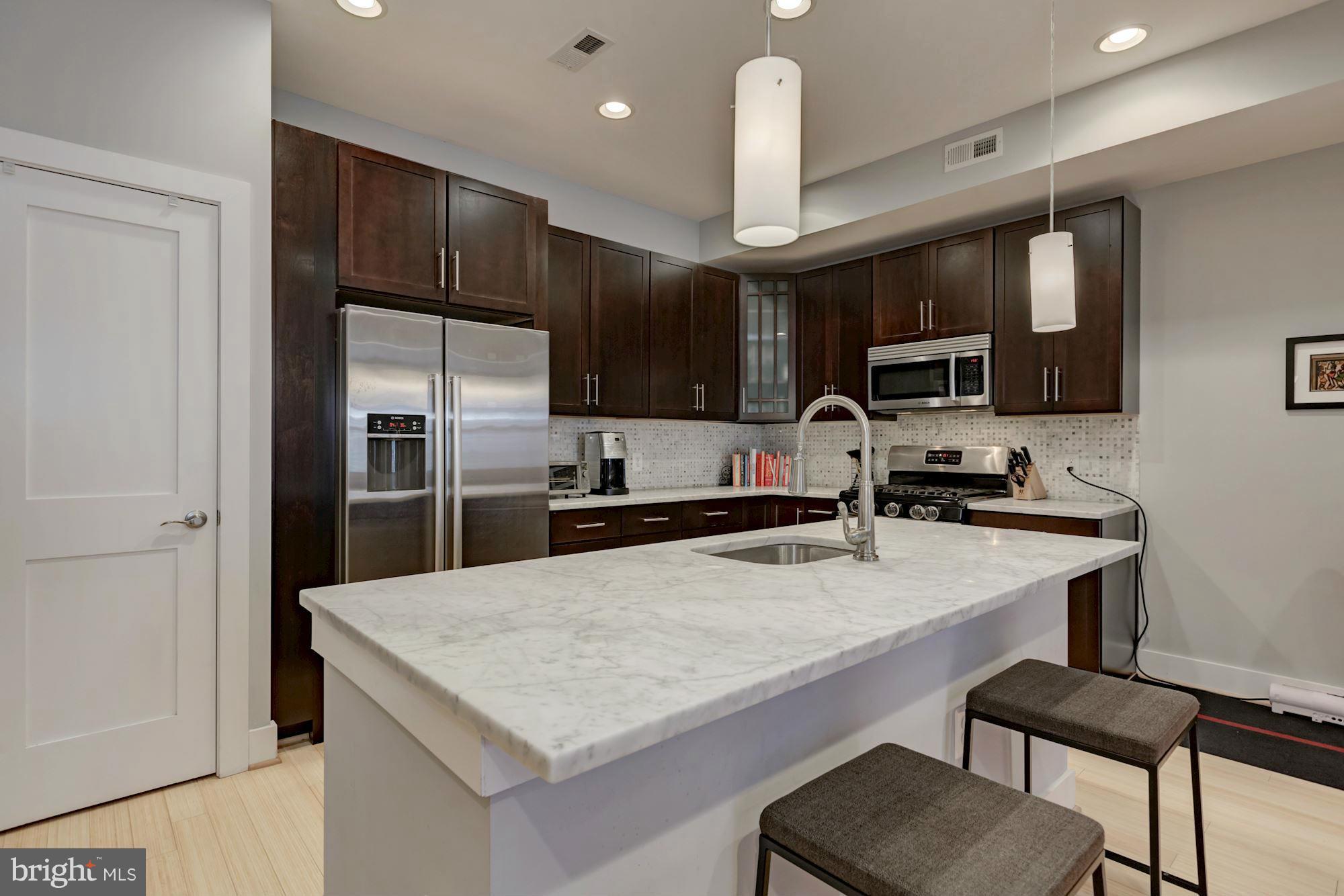 1202 Fairmont Street Northwest, Unit 2 Washington, DC 20009 - Photo 11 of 26 Expansive island & breakfast bar