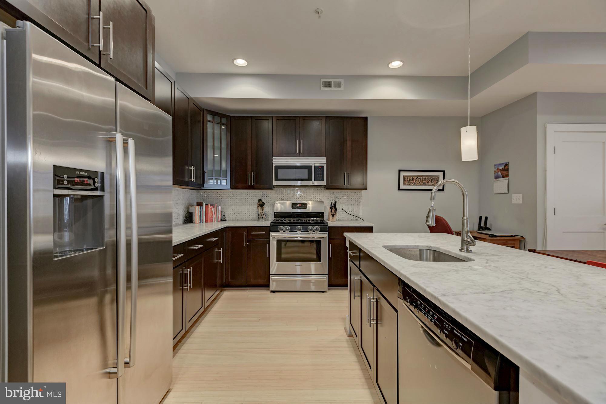 1202 Fairmont Street Northwest, Unit 2 Washington, DC 20009 - Photo 14 of 26 White Italian marble countertops & Bosch appls.