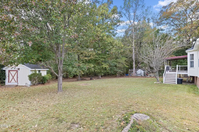 a view of a balcony with wooden floor