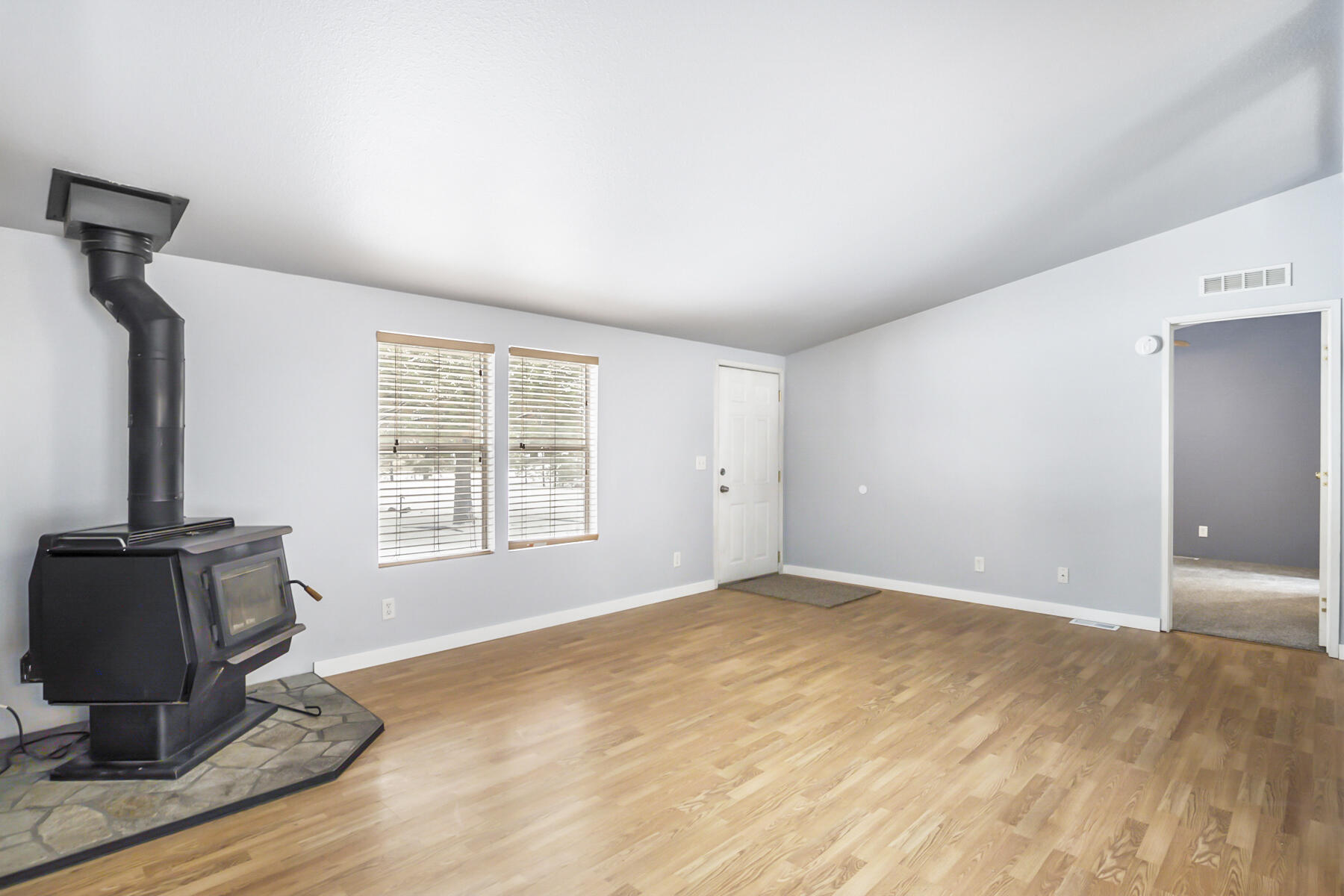 19271 Indian Summer Road Bend, OR 97702 - Photo 24 of 48 a view of a livingroom with wooden floor and a window