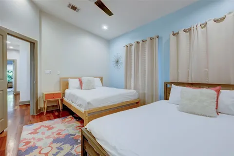 a bedroom with a bed and a table in it