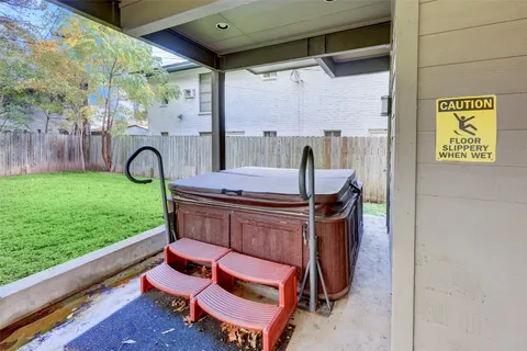 a patio with table and chairs