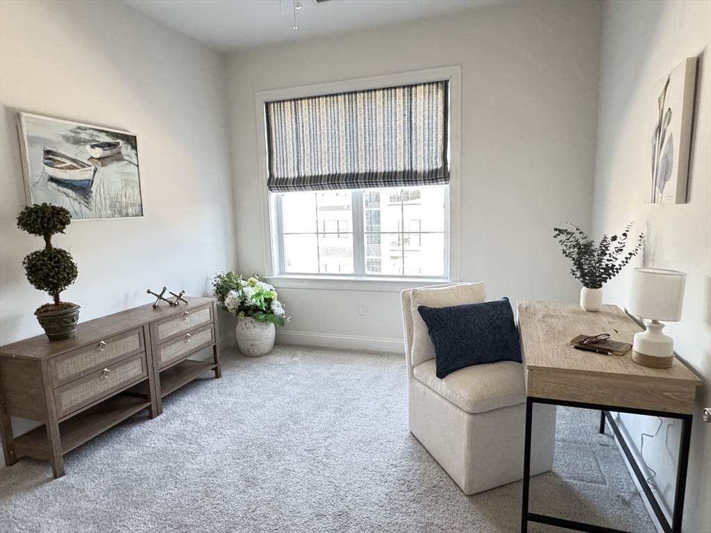 1 Revolution Way, Unit 307 Canton, MA 02021 - Photo 12 of 31 a living room with furniture and window