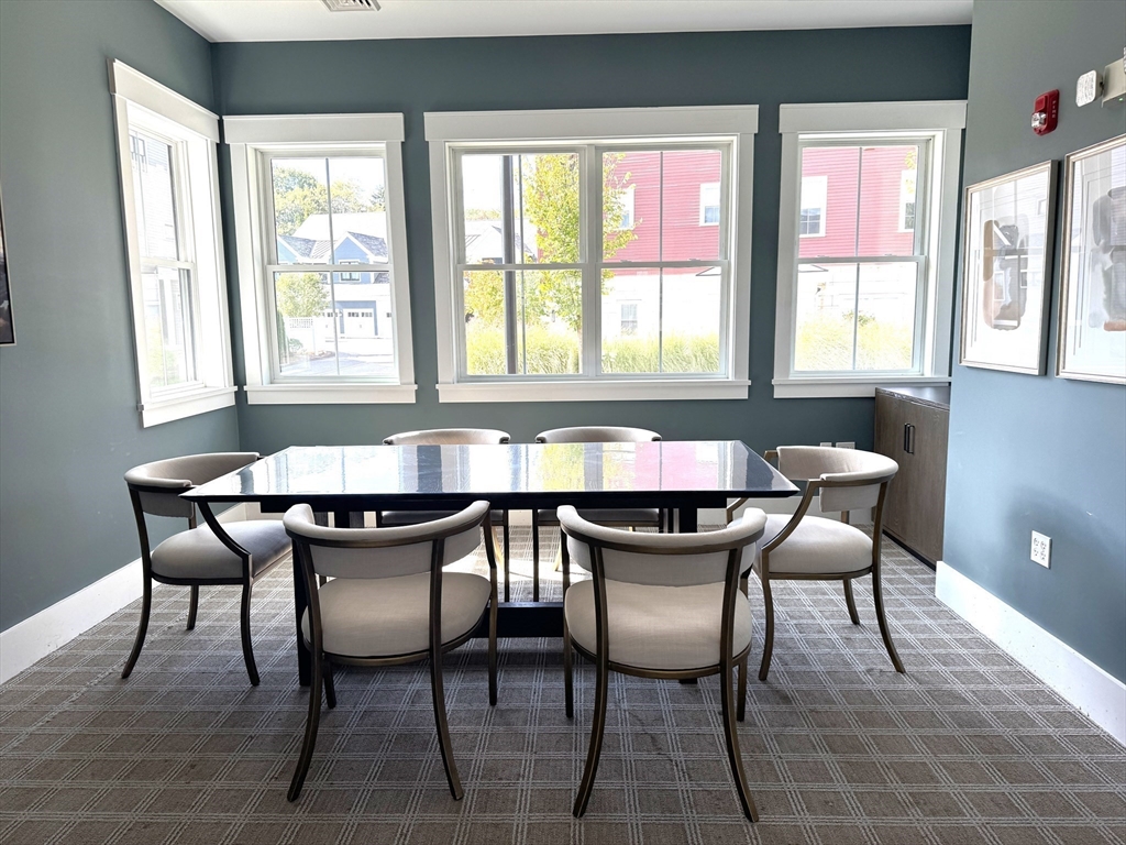 1 Revolution Way, Unit 307 Canton, MA 02021 - Photo 30 of 31 a view of a a dining room with furniture window and outside view