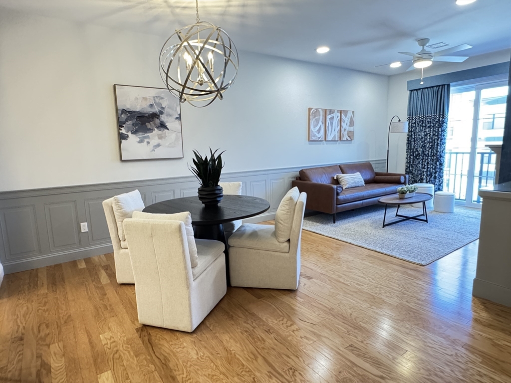 1 Revolution Way, Unit 307 Canton, MA 02021 - Photo 5 of 31 a living room with furniture and wooden floor