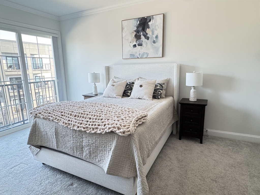 1 Revolution Way, Unit 307 Canton, MA 02021 - Photo 9 of 31 a bedroom with a bed and a window