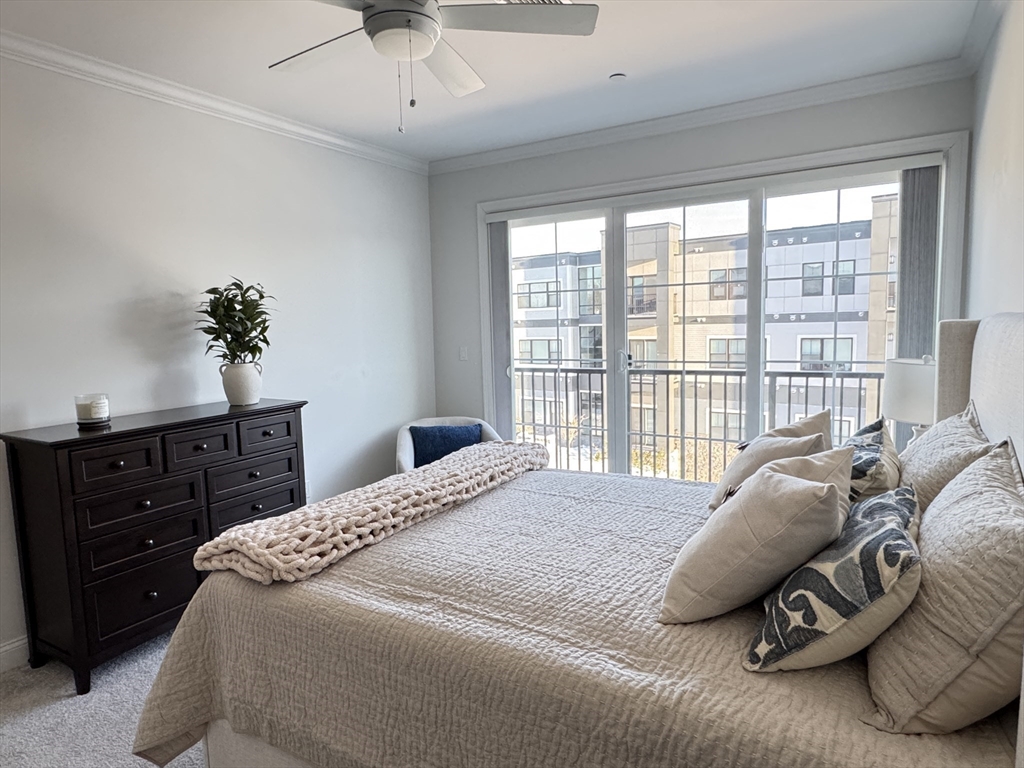 1 Revolution Way, Unit 307 Canton, MA 02021 - Photo 10 of 31 a bedroom with a bed and a window
