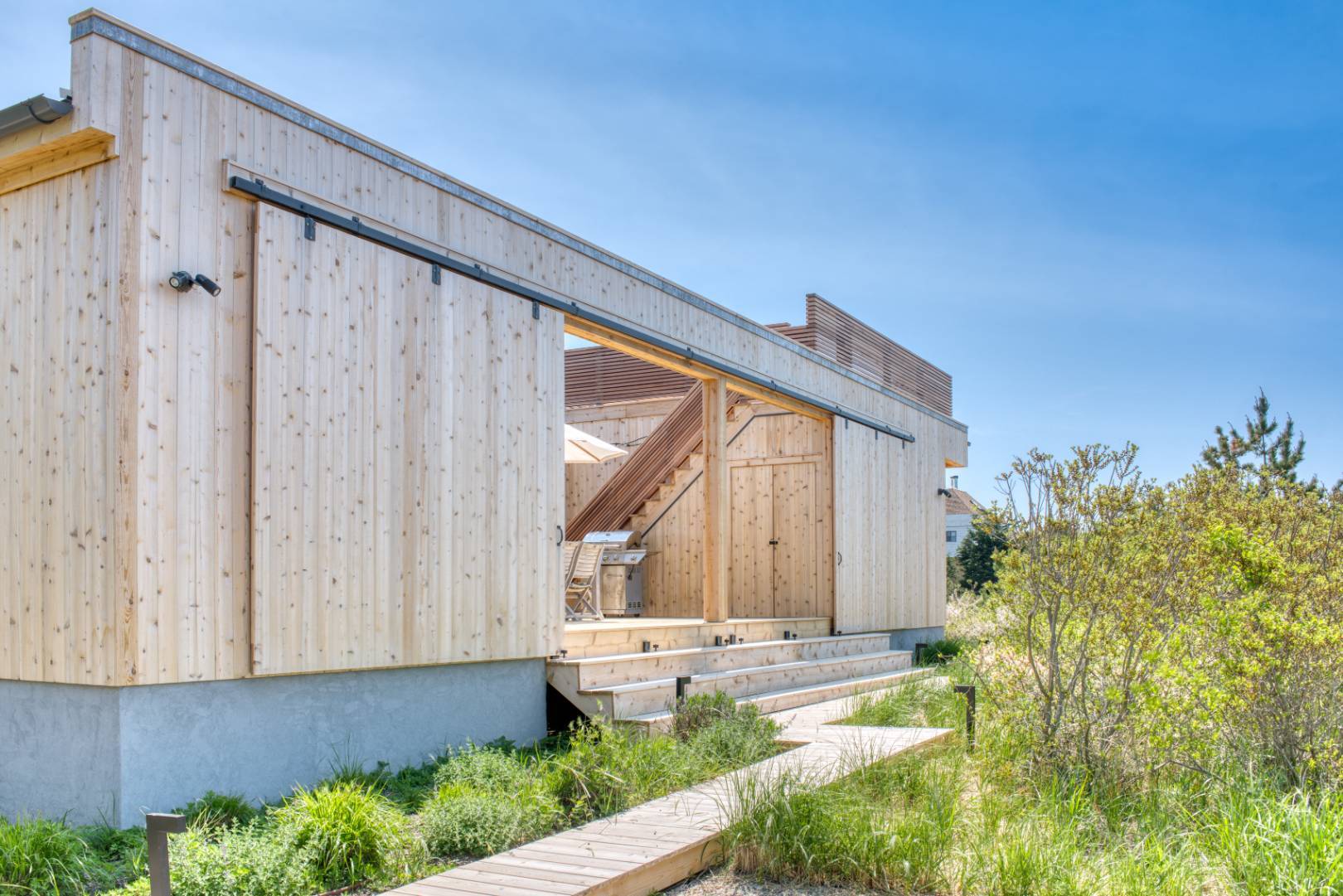 9 Marlin Drive Amagansett, NY 11930 - Photo 16 of 20 a view of house with backyard and garden