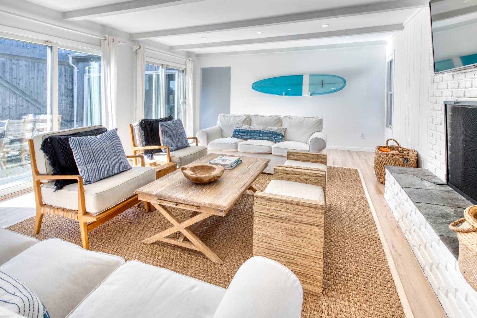 9 Marlin Drive Amagansett, NY 11930 - Photo 4 of 20 a living room with furniture a rug and a floor to ceiling window