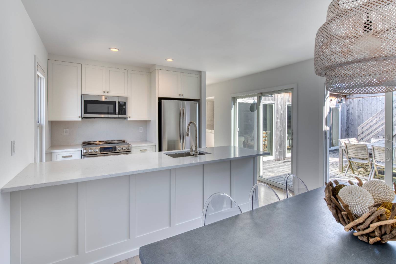 9 Marlin Drive Amagansett, NY 11930 - Photo 5 of 20 a kitchen with stainless steel appliances granite countertop a refrigerator and a stove top oven