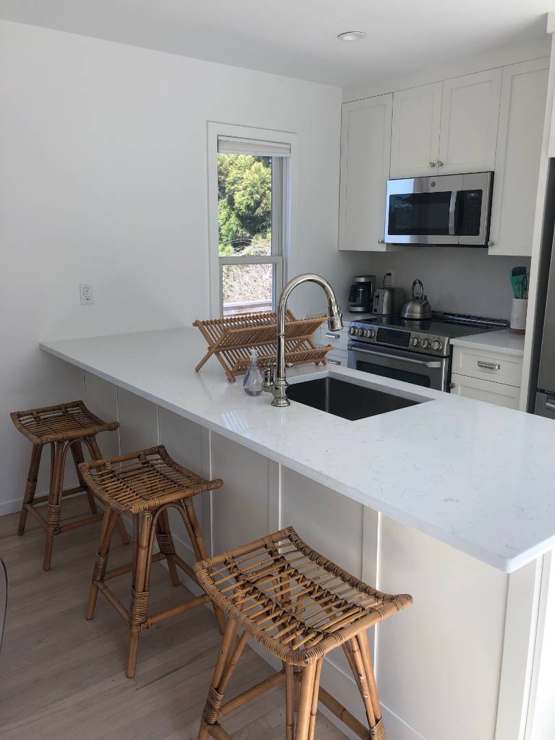 9 Marlin Drive Amagansett, NY 11930 - Photo 6 of 20 a kitchen with a sink cabinets and window