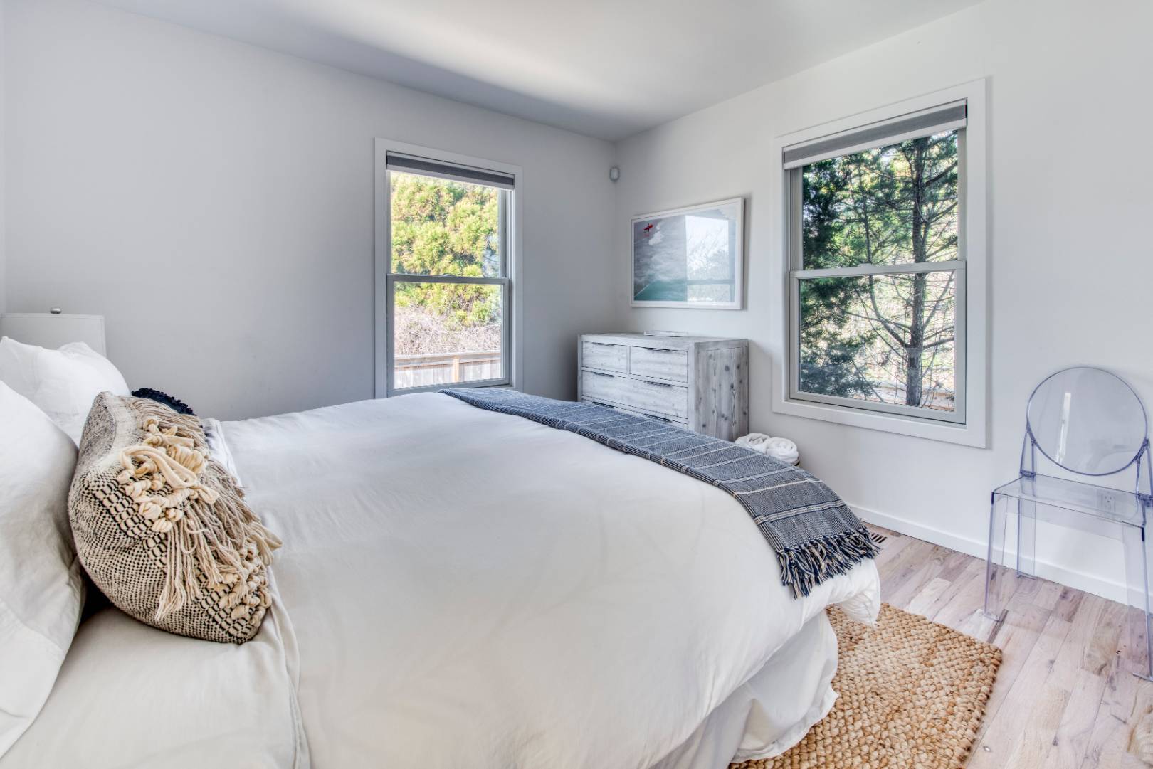 9 Marlin Drive Amagansett, NY 11930 - Photo 8 of 20 a bedroom with a bed and wooden floor