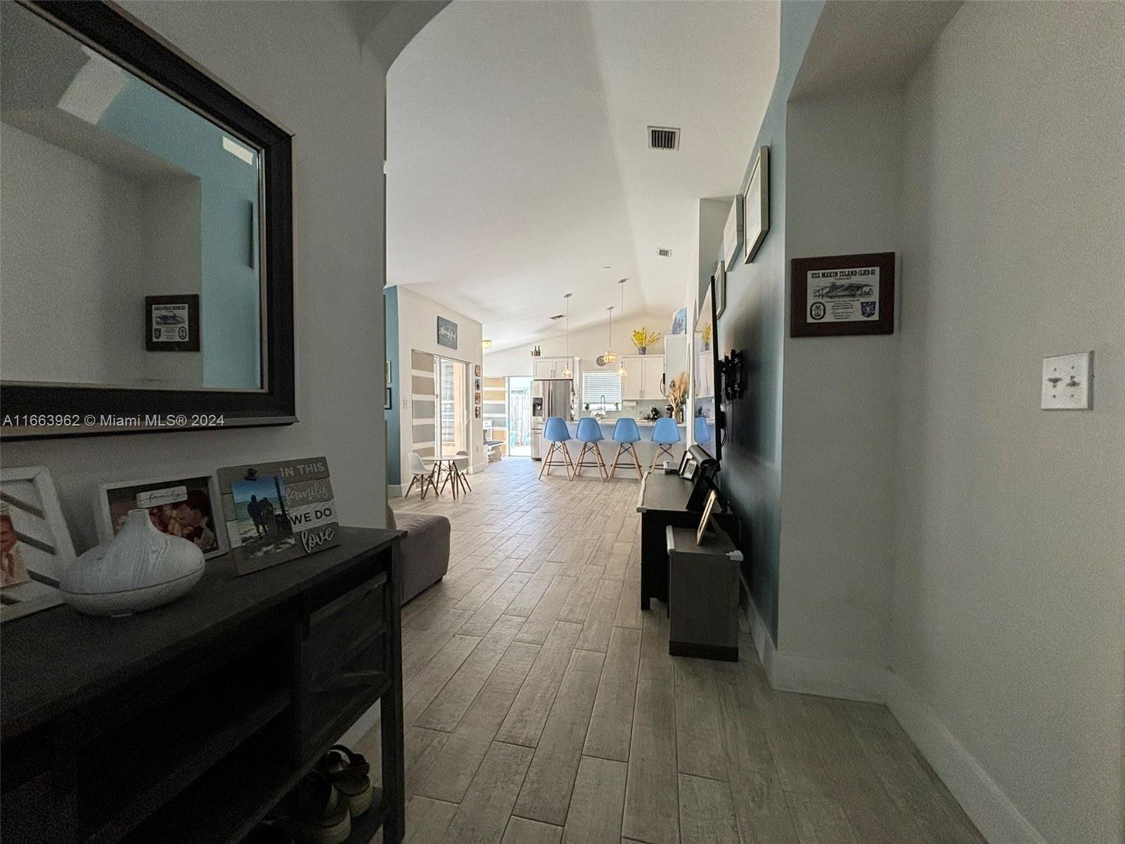 14170 Southwest 151st Avenue Miami, FL 33196 - Photo 11 of 23 a hallway with a view of living room