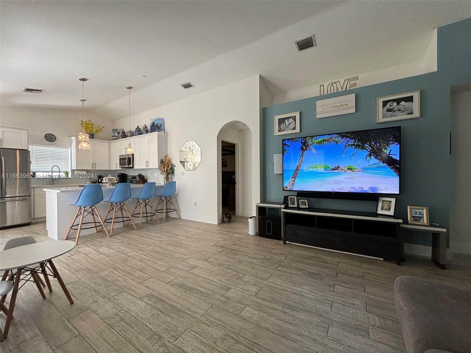 14170 Southwest 151st Avenue Miami, FL 33196 - Photo 12 of 23 a living room with furniture and a flat screen tv