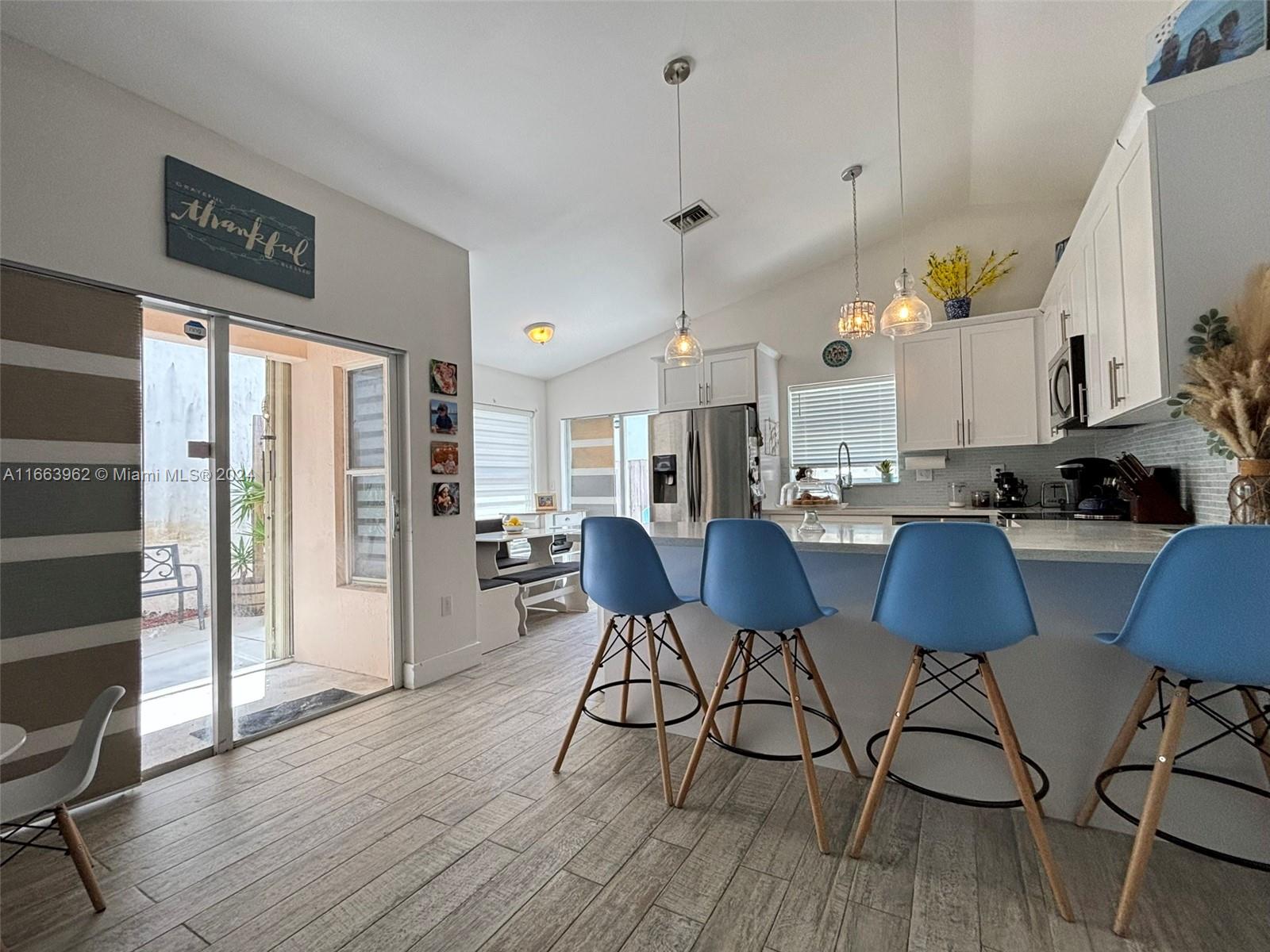 14170 Southwest 151st Avenue Miami, FL 33196 - Photo 14 of 23 a view of kitchen and dining area with furniture