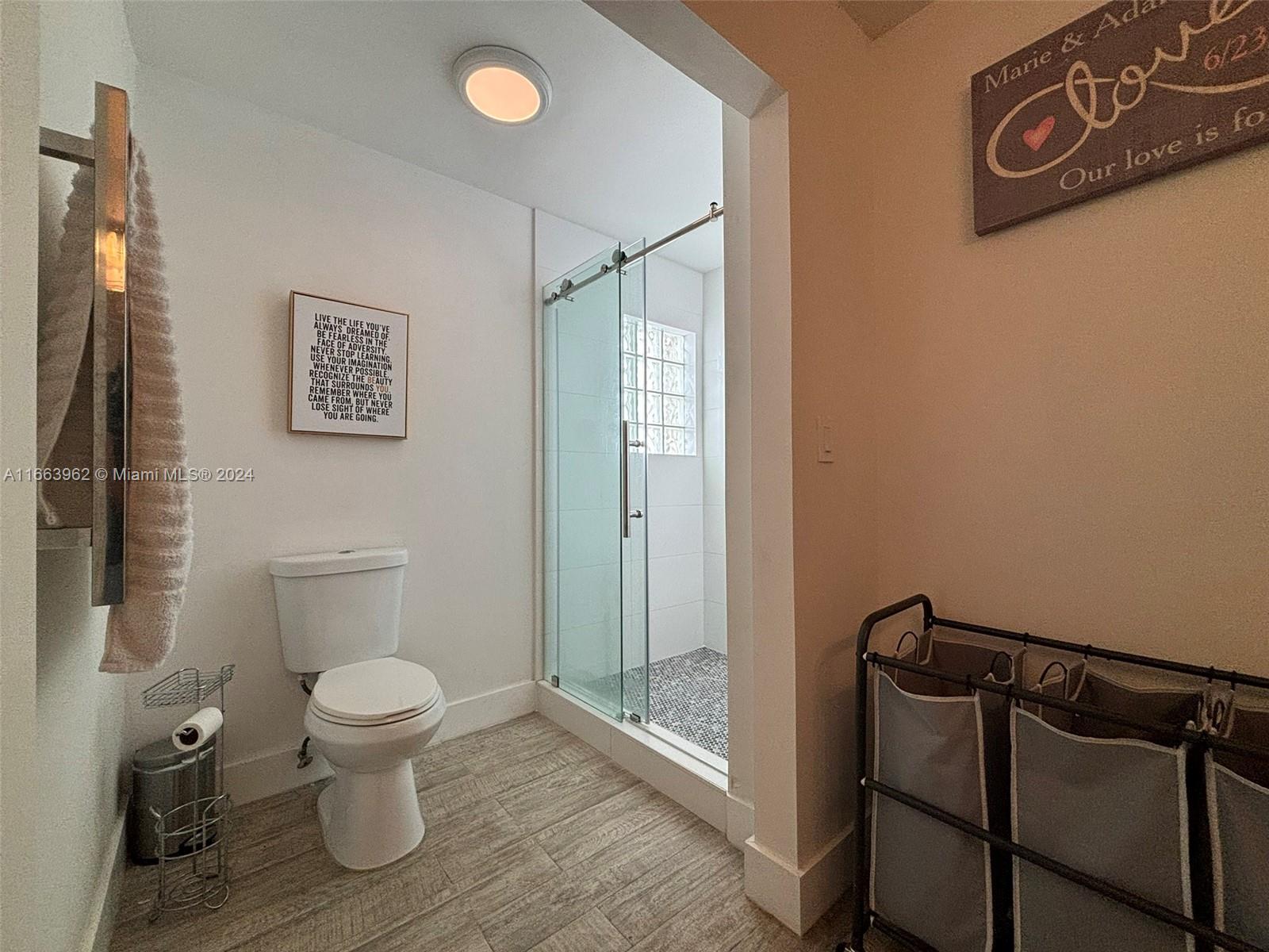 14170 Southwest 151st Avenue Miami, FL 33196 - Photo 17 of 23 a bathroom with a toilet and a shower