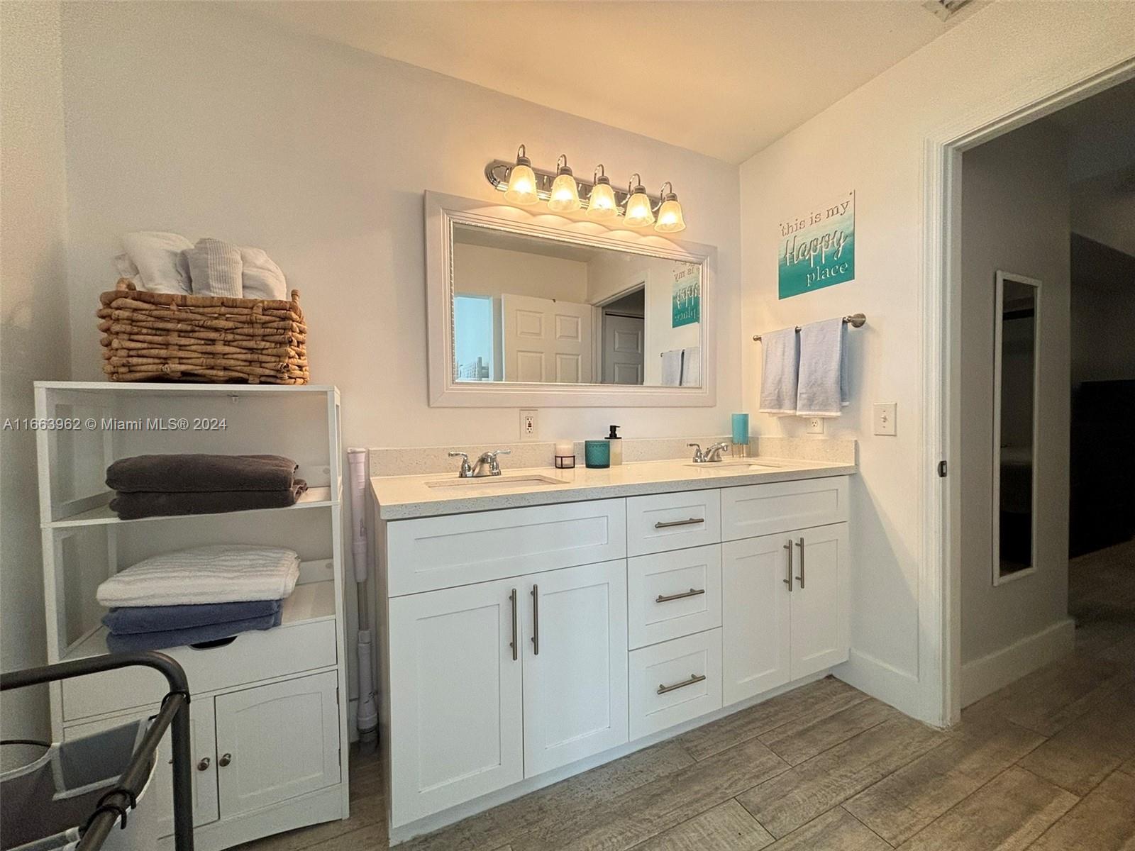 14170 Southwest 151st Avenue Miami, FL 33196 - Photo 18 of 23 a bathroom with a sink a mirror and a shower