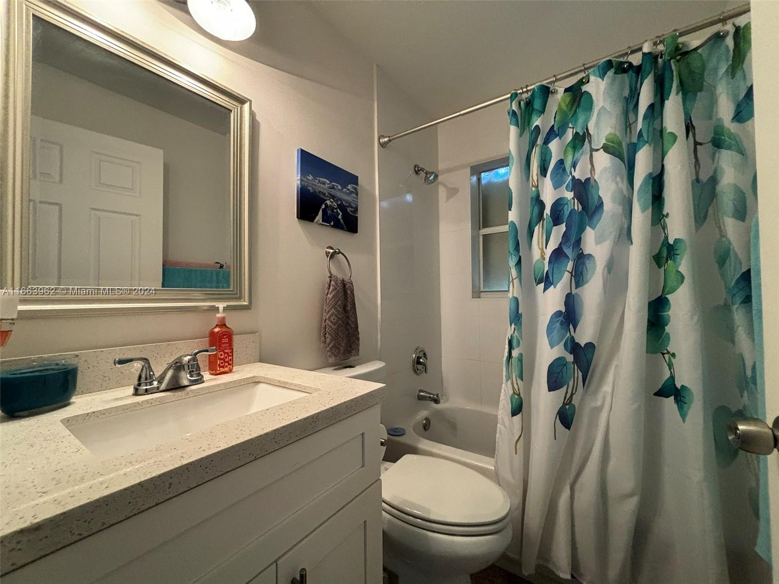 14170 Southwest 151st Avenue Miami, FL 33196 - Photo 7 of 23 a bathroom with a sink a toilet and shower