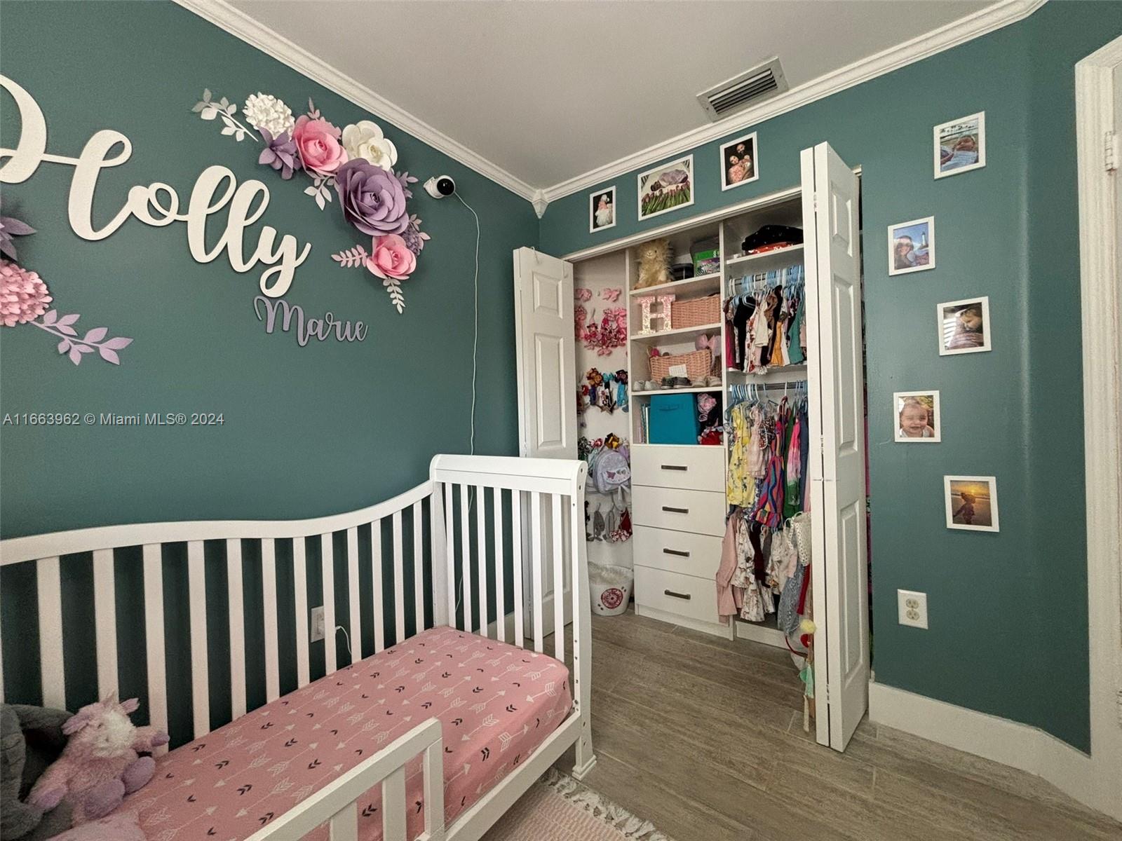 14170 Southwest 151st Avenue Miami, FL 33196 - Photo 8 of 23 a bedroom with a bed and wooden floor