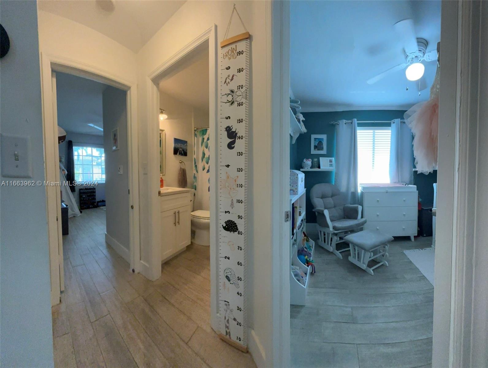 14170 Southwest 151st Avenue Miami, FL 33196 - Photo 10 of 23 a view of a hallway with a livingroom and a dinning room
