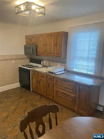 a kitchen with a stove and a sink