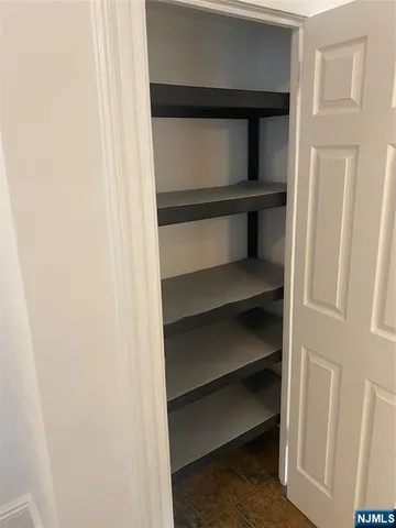 a view of an empty walk in closet