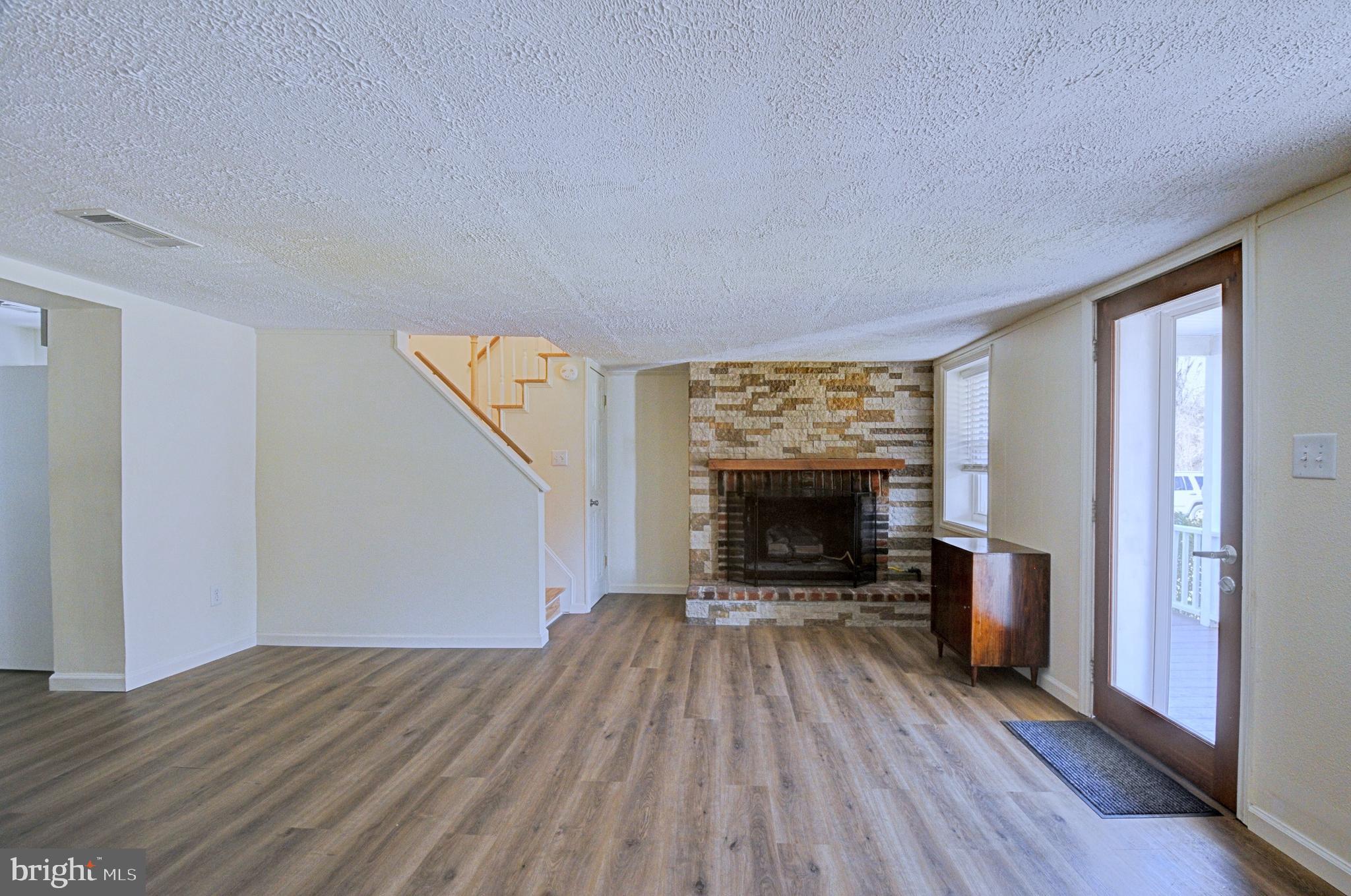 211 Ranger Court Winchester, VA 22602 - Photo 21 of 73 Living room with stone fireplace