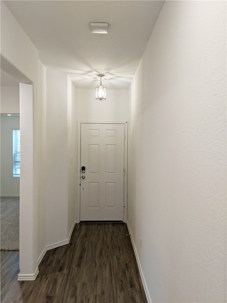 3493 Pauling Loop Round Rock, TX 78665 - Photo 2 of 19 a view of a room with wooden floor