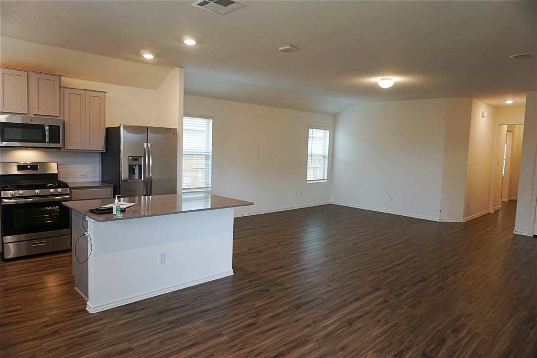 3493 Pauling Loop Round Rock, TX 78665 - Photo 19 of 19 a kitchen with stainless steel appliances a refrigerator and a stove top oven