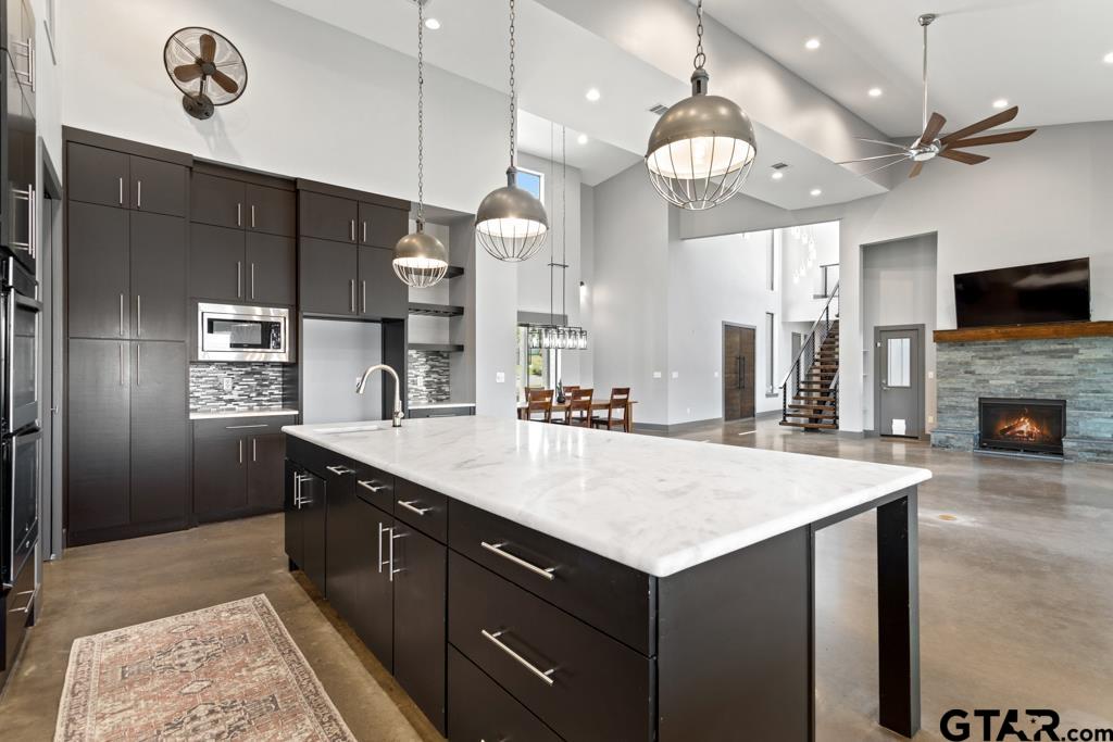 24116 Sun Ridge Road Lindale, TX 75771 - Photo 12 of 47 a large kitchen with a table and chairs in it
