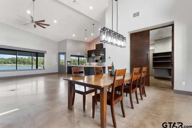 a dining area with furniture and window