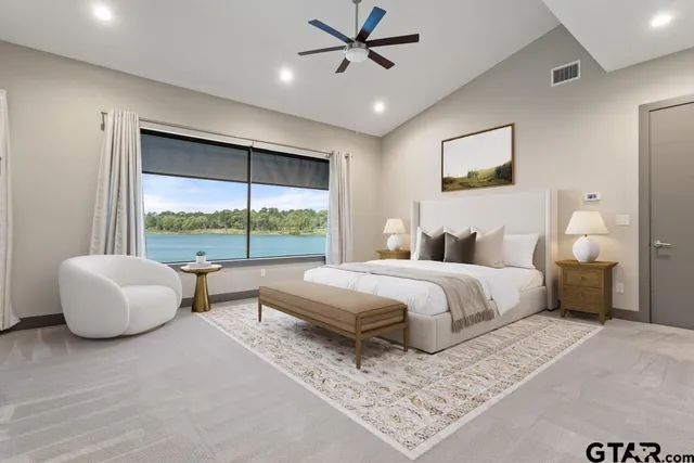 a view of an empty room with a fireplace and a window