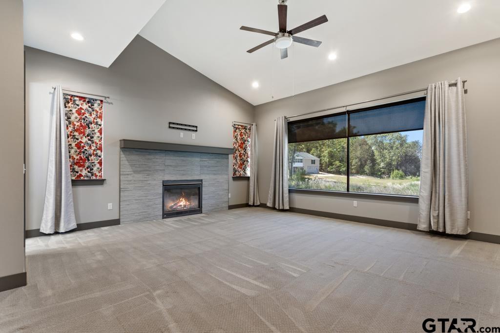 24116 Sun Ridge Road Lindale, TX 75771 - Photo 20 of 47 a view of an empty room with a fireplace and a window