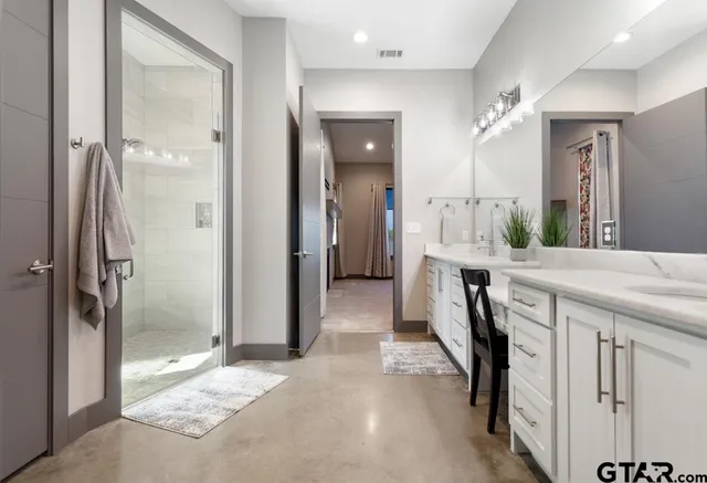 a room with wooden floor and a fireplace