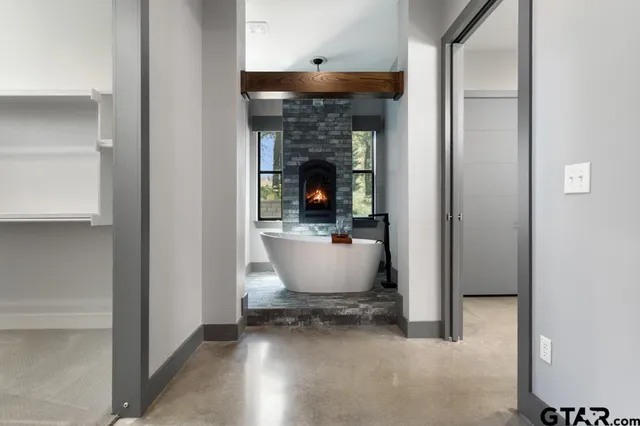 a view of room with window and wooden floor