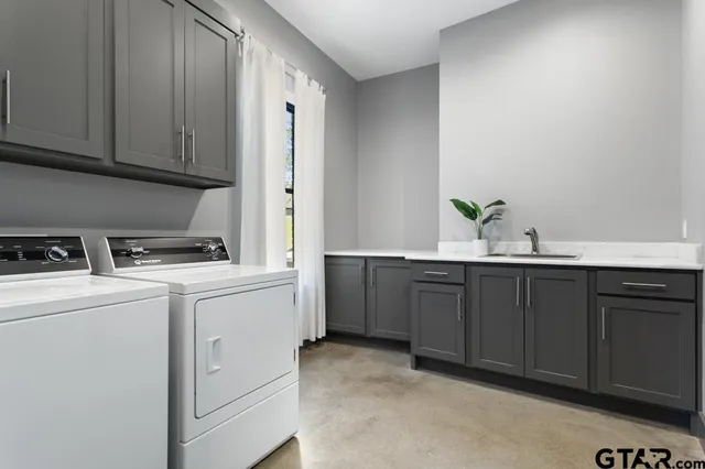 a living room with stainless steel appliances kitchen island granite countertop furniture and a large window