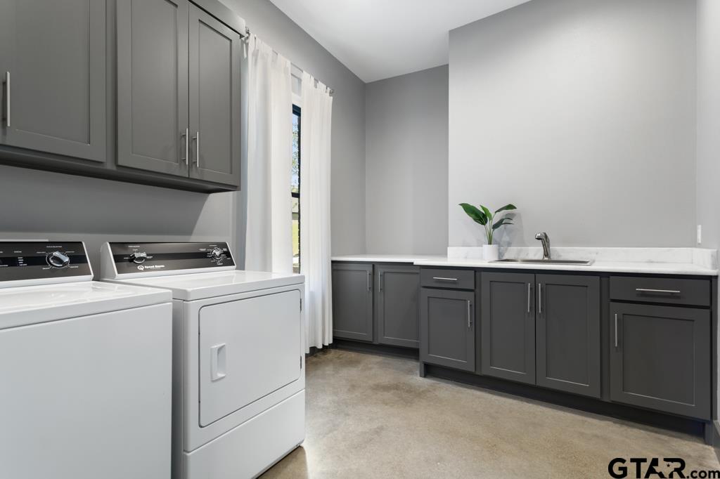 24116 Sun Ridge Road Lindale, TX 75771 - Photo 26 of 47 a kitchen with sink and cabinets